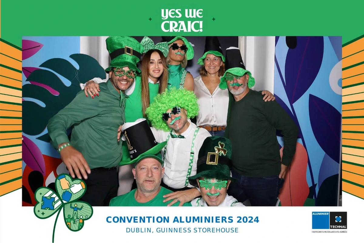 Colleagues enjoying a photo booth at a company party